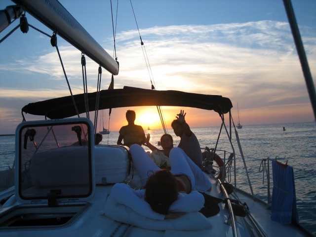  Lying with friends on the boat 